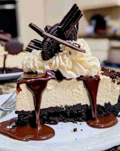 TRIPLE CHOCOLATE CHEESECAKE Ingredients: Crust: 2 cups crushed chocolate sandwich cookies (like Oreo...