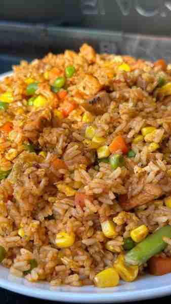 Spicy Chicken Fried Rice Ingredients: 2 cups cooked rice 1 cup cooked chicken, diced 1 cup mixed veg...