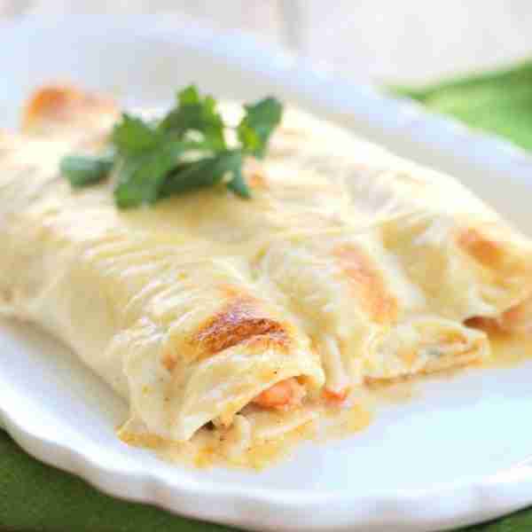 These Creamy Shrimp Enchiladas are rich, flavorful, and packed with veggies and tender shrimp—all wr...