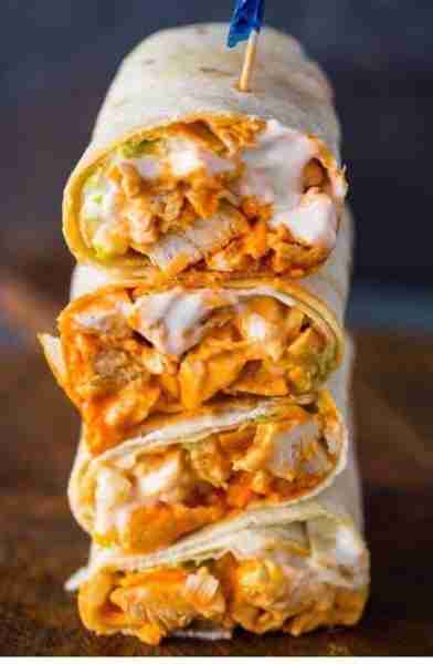 A chicken wrap with a creamy buffalo sauce and other fresh ingredients. Ingredients: For the Chicke...