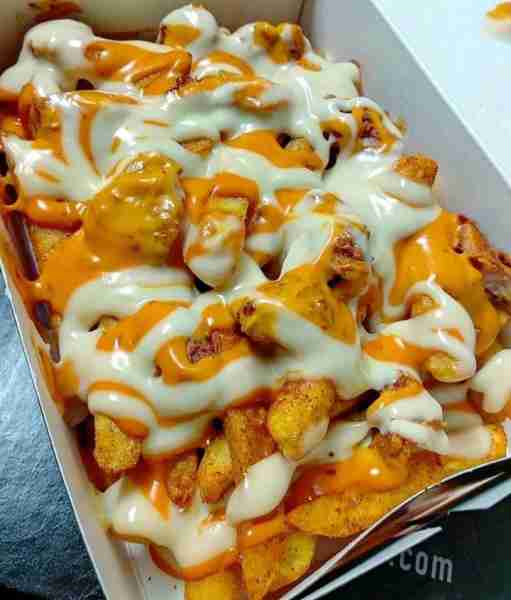Loaded fries with cheese and spicy sauce. Ingredients: For the Fries: 4 medium-sized potatoes (or 1...
