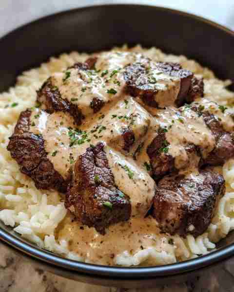 Creamy Cajun Steak Bites with Rice Skillet Ingredients: 1 lb steak (sirloin or ribeye), cut into bit...