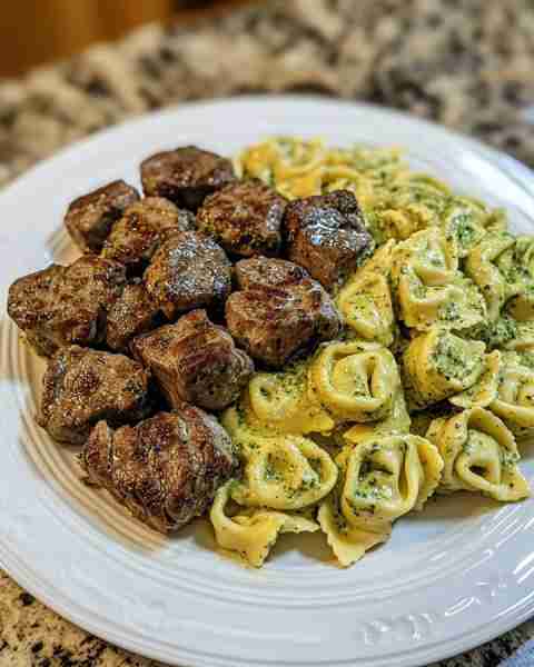 Pesto Alfredo Tortellini with Steak Bites in Garlic Butter Ingredients: 1.5 lb sirloin steak, cut in...