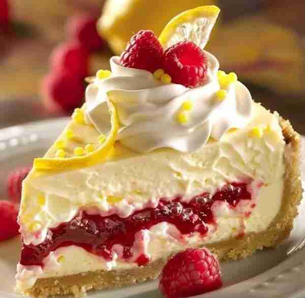 🍋💖 Refreshing No Bake Lemon Raspberry Cheesecake Ingredients: For the Crust: 1 1/2 cups graham cra...