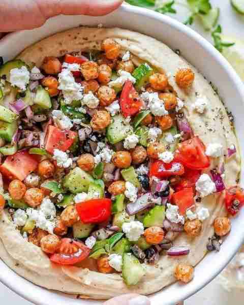 Loaded Roasted Garlic Hummus - Greek Style - Serve alongside your favorite healthy cracker assortmen...