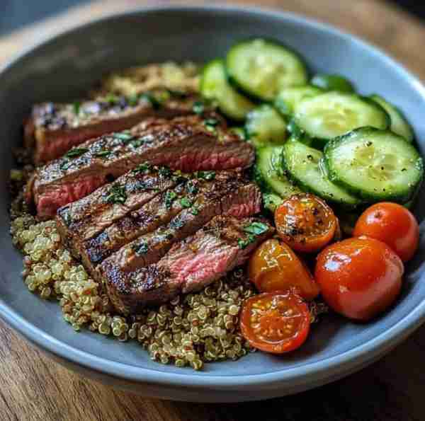 Grilled Steak with Quinoa Salad Ingredients: - 1 lb lean steak (sirloin or flank) - 1 cup quinoa - 1...