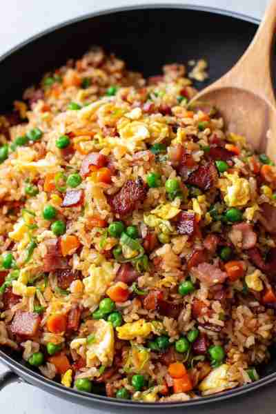 This easy bacon fried rice is smoky, savory, and ready in minutes—what happens when crispy bacon mee...