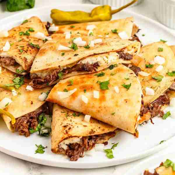 Mississippi Pot Roast Quesadillas! What happens when rich, fall-apart tender pot roast meets the gol...