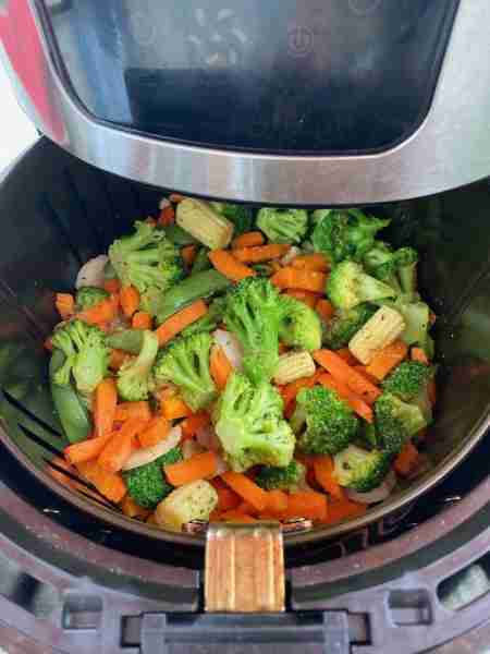 air fryer frozen vegetables are amazing! Just dump the package of mixed frozen veggies in the air fr...