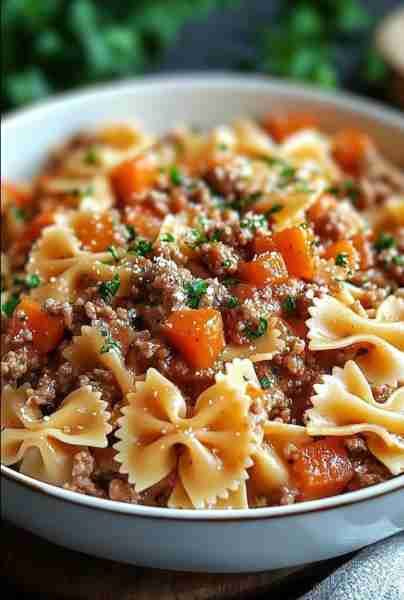 Bowtie Pasta with Ground Beef Ingredients: 12 oz bowtie (farfalle) pasta 1 lb ground beef 1 tbsp oli...
