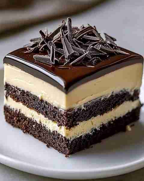 Decadent Tuxedo Cake Delight Ingredients For the Cake: 1 cup unsweetened cocoa powder 3 cups all-pu...