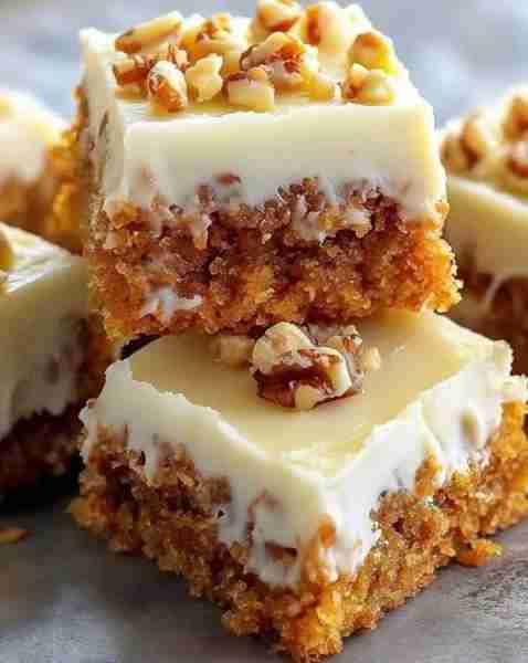 Decadent Carrot Cake Bars with Cream Cheese Frosting Ingredients: 2 cups all-purpose flour 1 1/2 tea...