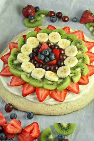 Fruit Pizza on a Sugar Cookie Crust! 🍓🍌 Delicious Fresh Fruit is Beautifully arranged on top of a...