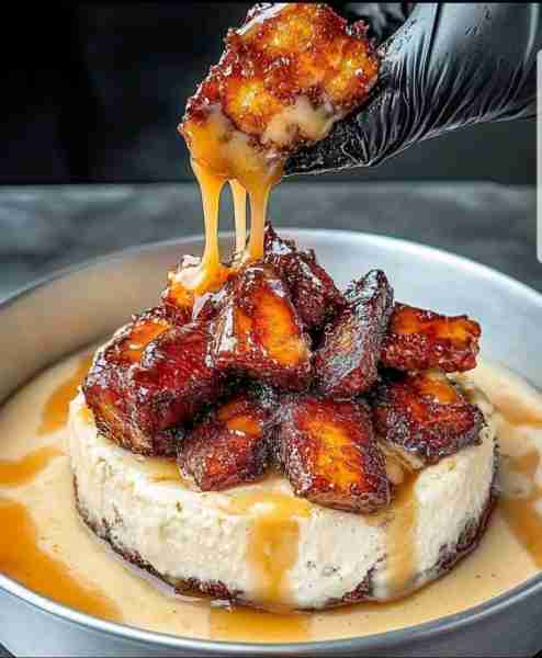 Caramelized Banana Cheesecake with Rum Glaze 🍌🍰 Ingredients: For the Crust: 1 1/2 cups graham crac...