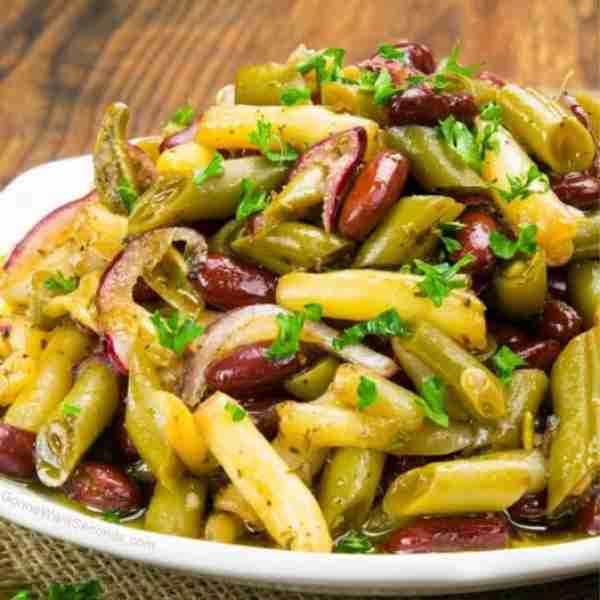 Three Bean Salad! 🍴 Soaked in a tangy, sweet marinade and will be an awesome potluck addition or an...
