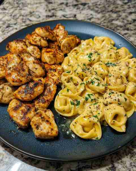 ONE-POT CREAMY CAJUN CHICKEN TORTELLINI Ingredients: 2 boneless, skinless chicken breasts, cut into...