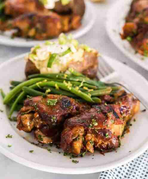 Slow Cooker Chicken Legs and Baked Potatoes combines succulent chicken legs with tender, flavorful p...