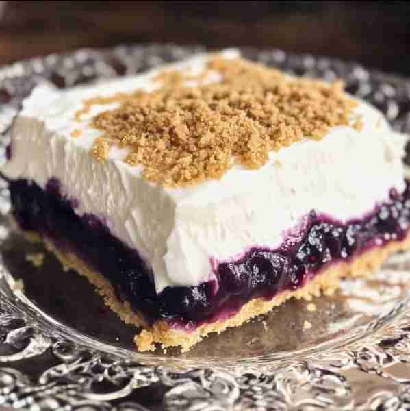Blueberry Delight (No-Bake Dessert) A creamy, layered dessert with a buttery graham cracker crust, s...