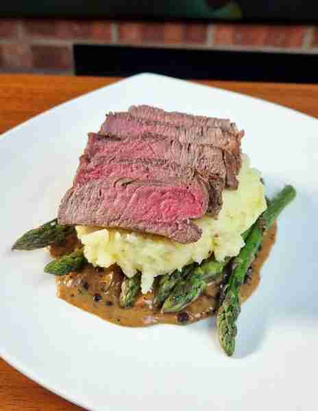 Steak on mash, asparagus and peppercorn sauce by Blaze K