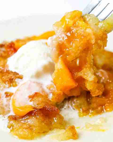 "This is truly the most amazing, delicious, and seriously the easiest peach cobbler recipe you will...