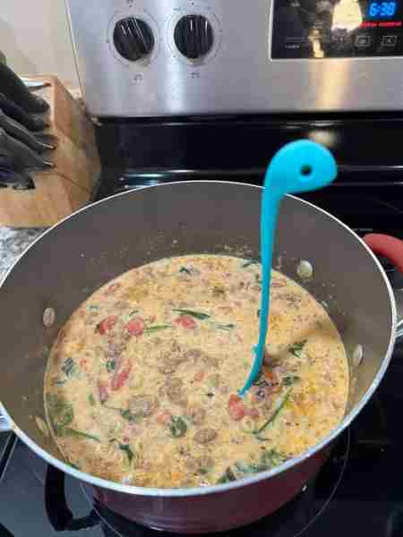 I added 2 cups fresh spinach in the last 3-5 minutes. I also used hot Italian sausage. It was amazin...