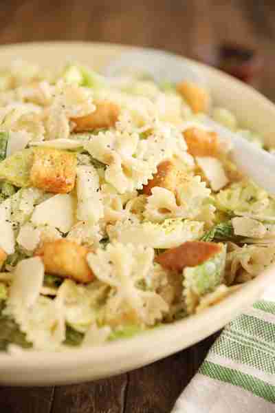 Pasta Caesar Salad is a simple, bold, tangy salad served as a side dish for summer meals, but makes...