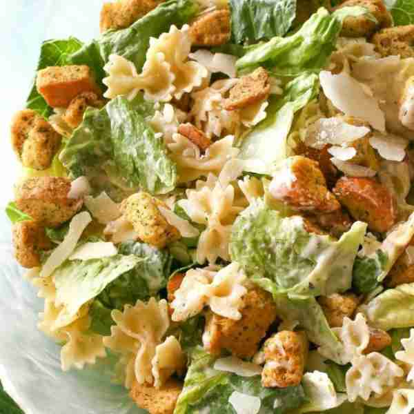 This Bowtie Chicken Caesar Salad is a fresh, filling twist on the classic! With tender chicken, crea...