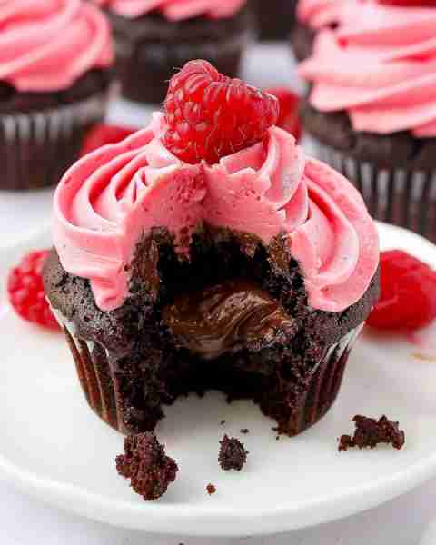 Nutella Stuffed Chocolate Cupcakes with Raspberry Frosting Ingredients For the Chocolate Cupcakes: 1...