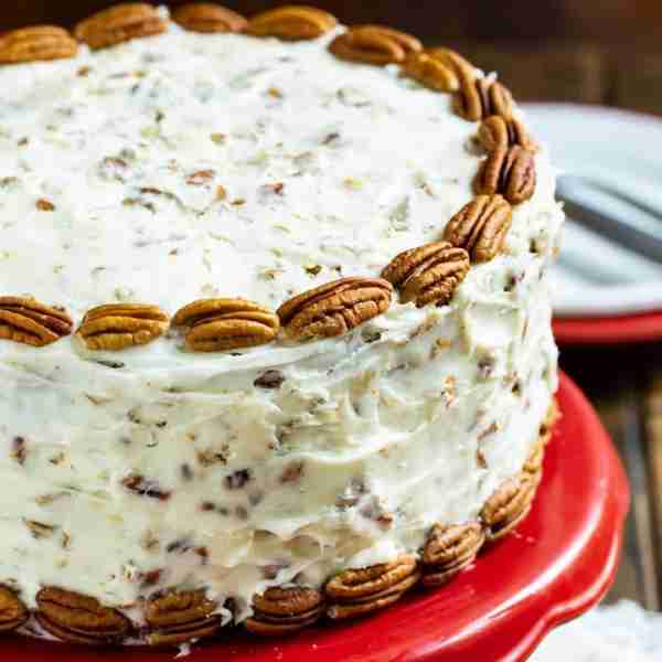 Italian Cream Cake has three layers of moist cake covered in cream cheese frosting with plenty of co...
