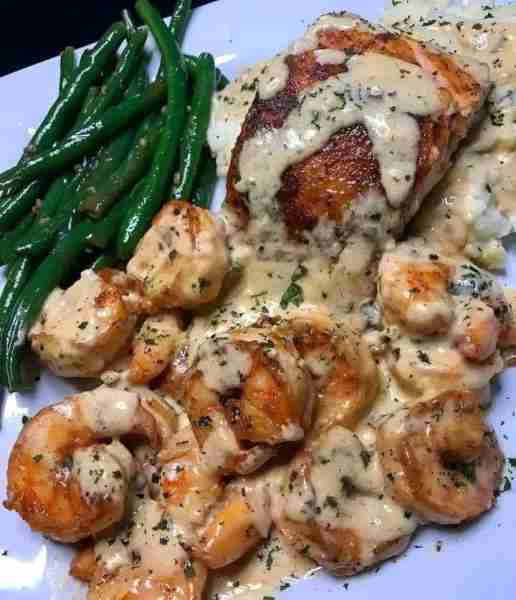 Cajun Shrimp and Salmon with Garlic Cream Sauce Who said gourmet meals have to be complicated? Whip...