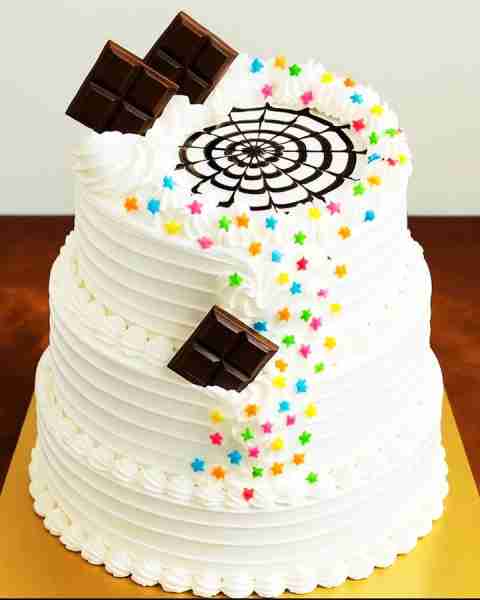 🎂 White Cream Cake with Chocolate Bars & Rainbow Stars ✨🌈🍫 A soft vanilla cake layered with fluf...
