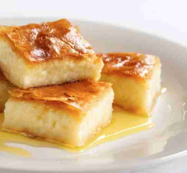 Golden, syrupy, and filled with creamy custard… Galaktompoureko is one of Greece’s sweetest treasure...