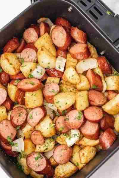 With this air fryer sausage and potatoes meal, well seasoned potato cubes, onions and smoked sausage...