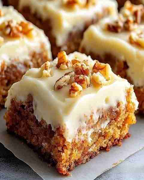 Decadent Carrot Cake Bars with Cream Cheese Frosting 🥕🍰 Ingredients: 1 ½ cups all-purpose flour 1...