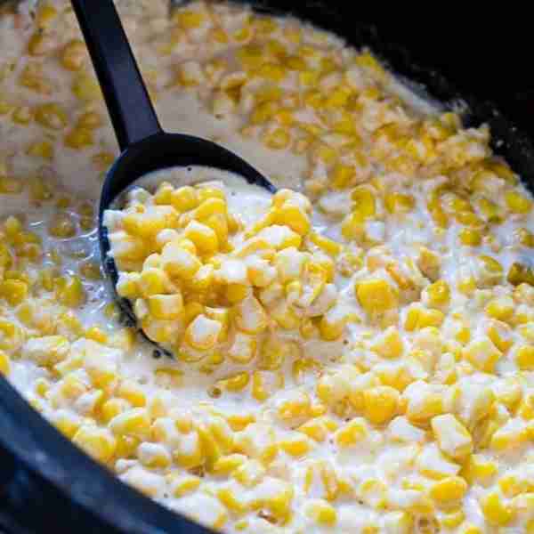 Slow Cooker Creamed Corn cooks up super creamy and sweet. Cream cheese, butter, and half-and-half ma...