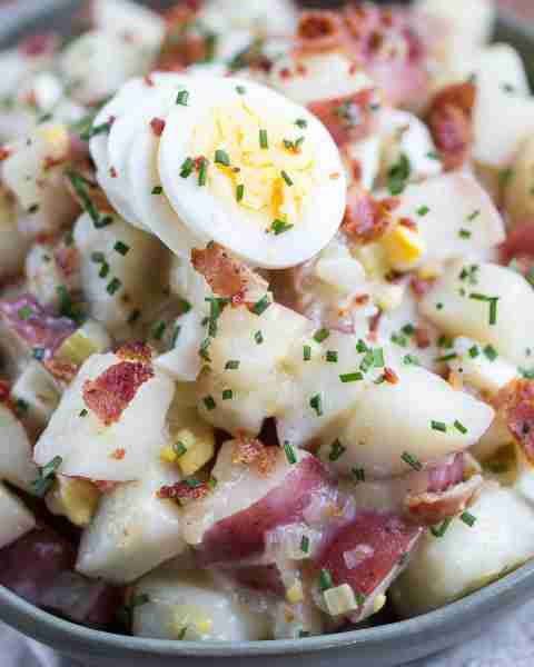 Get Oktoberfest started right with a traditional German Potato Salad. It's made with bacon and boile...