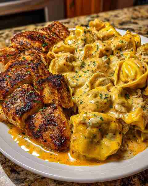 Creamy Garlic Chicken Tortellini in Cajun Velveeta Alfredo Cheese Sauce Ingredients: 1 pound cheese-...