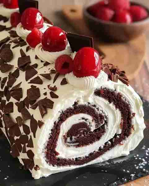 🍒 Elegant Black Forest Roll Cake 🍫 Rich chocolate sponge, whipped cream, and juicy cherries — all...