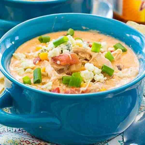 Crock Pot Buffalo Chicken Chili is a creamy and rich white bean chili with shredded chicken, corn, f...