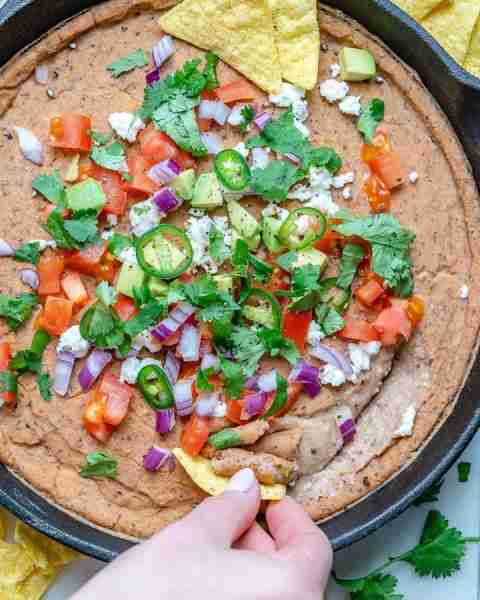 Time to spice up your snack plate this weekend! This Mexican Bean Dip recipe deliciously blends prot...