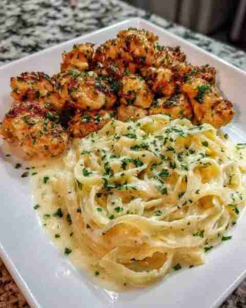 Garlic Butter Chicken Pasta with Creamy Parmesan Sauce Ingredients: For the Chicken Bites: 1 lb bone...