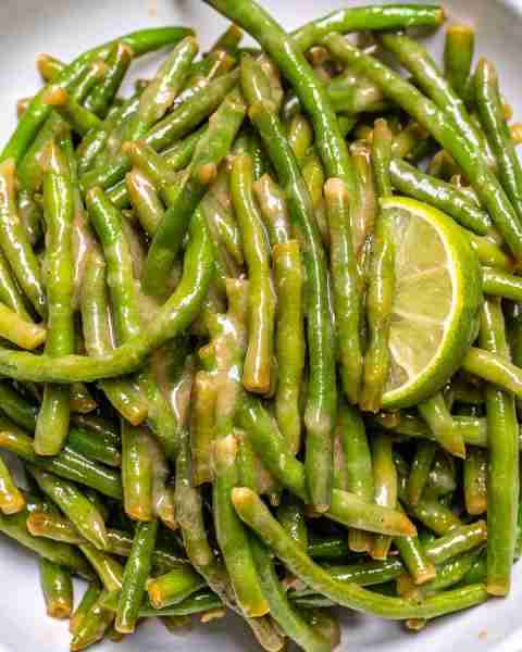 This SIMPLE Creamy Braised Green Beans recipe keeps the beans tender-crisp, and lightly coated in a...
