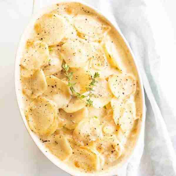 Gratin Dauphinois is a traditional, luxurious French casserole made with thinly sliced potatoes, cre...