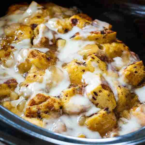 Crock Pot Apple Pie Cinnamon Roll Casserole is a gooey and delicious fall breakfast or brunch. So ea...