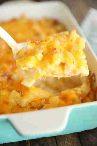 This Shortcut Cheesy Scalloped Potatoes recipe swaps fresh potatoes for frozen diced hash browns for...