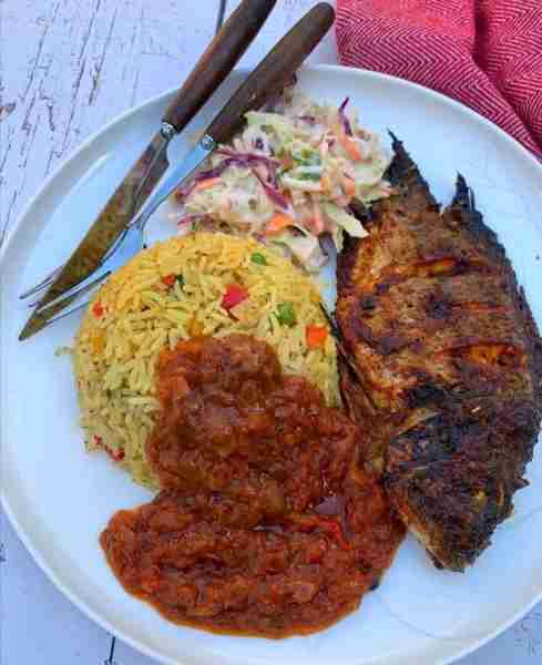 Flavorful Grilled Fish Meal with Jollof Rice, Tomato Sauce & Coleslaw Ingredients For the Grilled Fi...