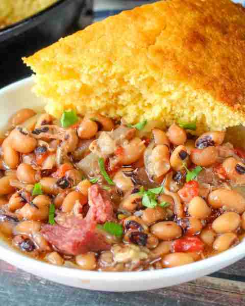 "This slow cooker black-eyed peas with ham is easy, very tasty, and wonderful with cornbread!" - Jud...