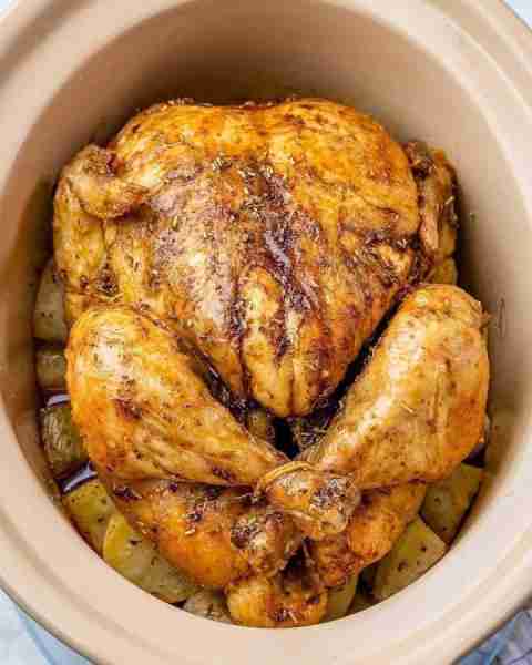 Slow Cooker Whole “Roast” Chicken + Potatoes - Juicy and ultra-flavorful, thanks to all the seasonin...
