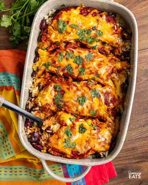 Mexican Chicken and Rice Bake - Cheesy Spicy Mexican Chicken with Enchilada sauce baked over rice an...