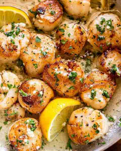 Buttery Garlic Seared Scallops Golden seared scallops in a rich garlic butter sauce with a hint of l...
